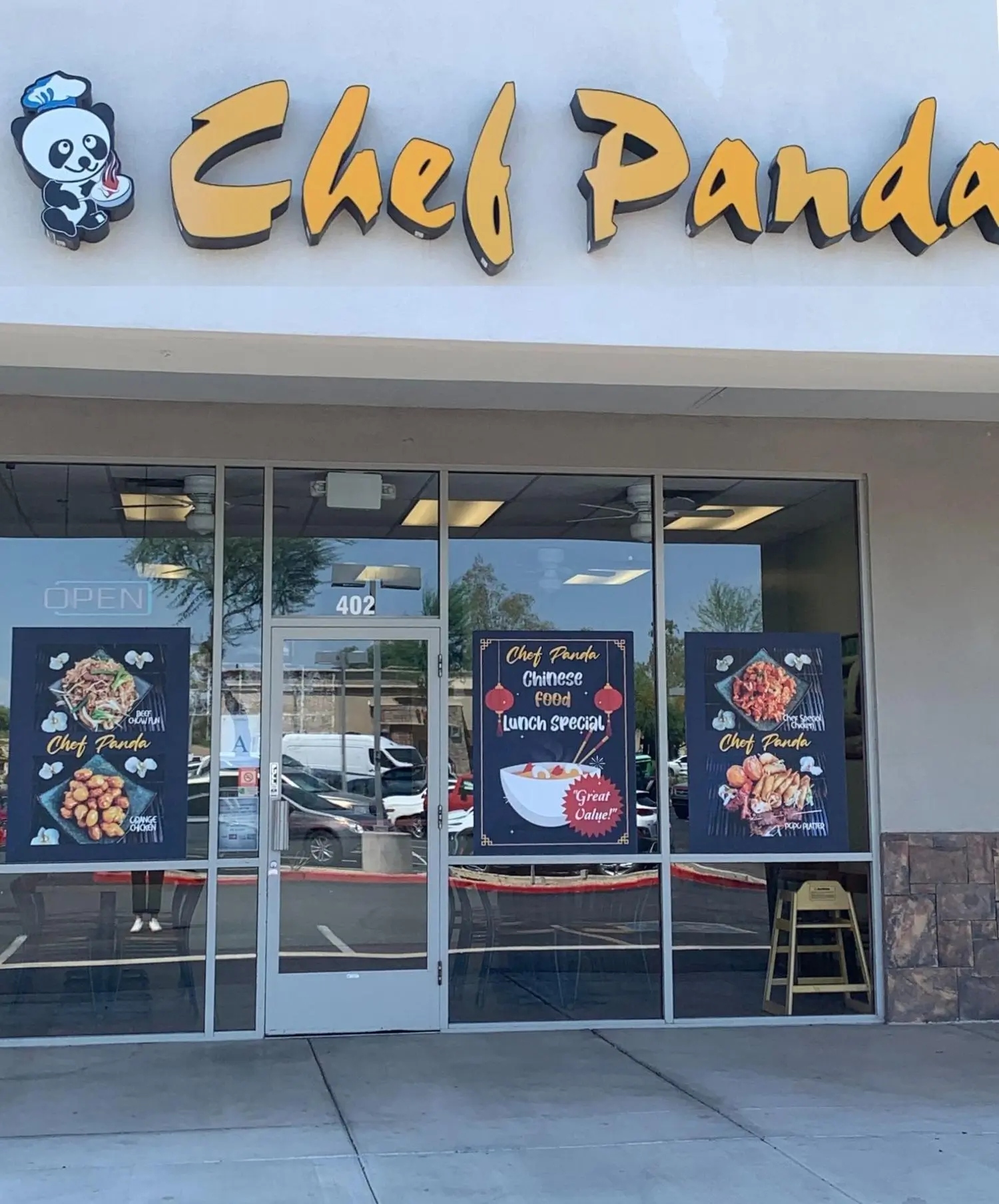 Exterior of Chef Panda with "Chef Panda" sign and food posters on windows at Chef Panda, a Chinese Restaurant in Surprise
